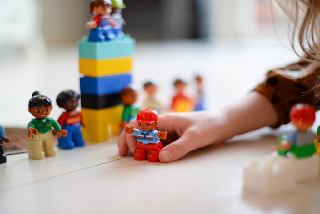 kid playing with legos