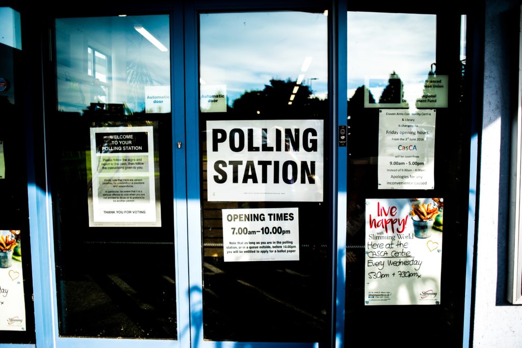 Picture showing a sign that says "Polling Station" on a door