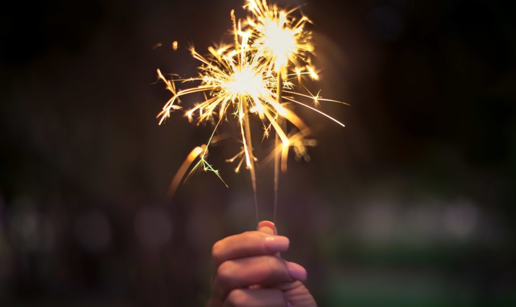 Person holding up a sparkler