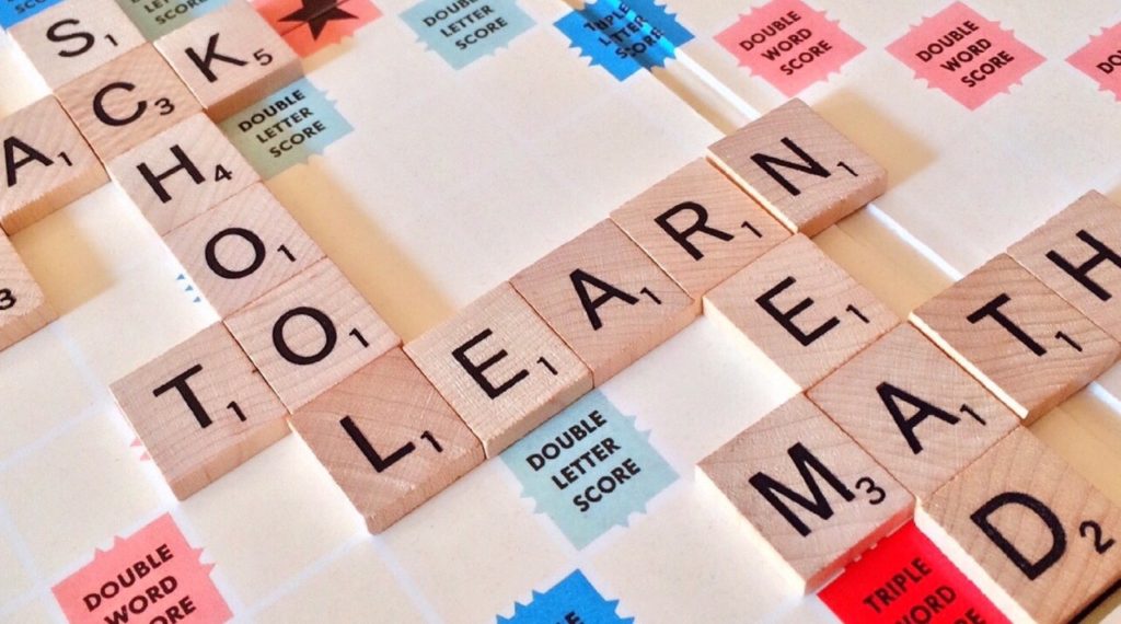 Scrabble board that says "School," "Learn," "Read," and "Math"