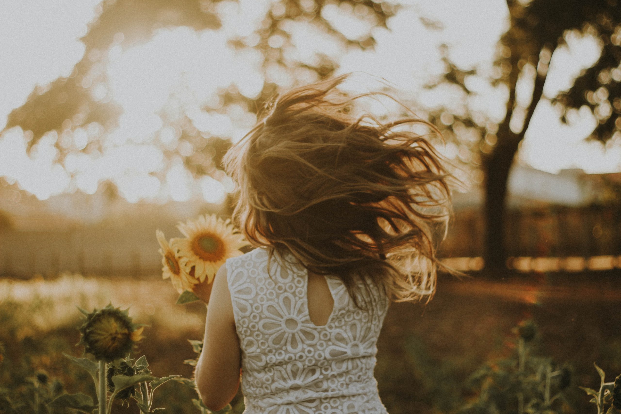 Woman running with hair flowing behind her