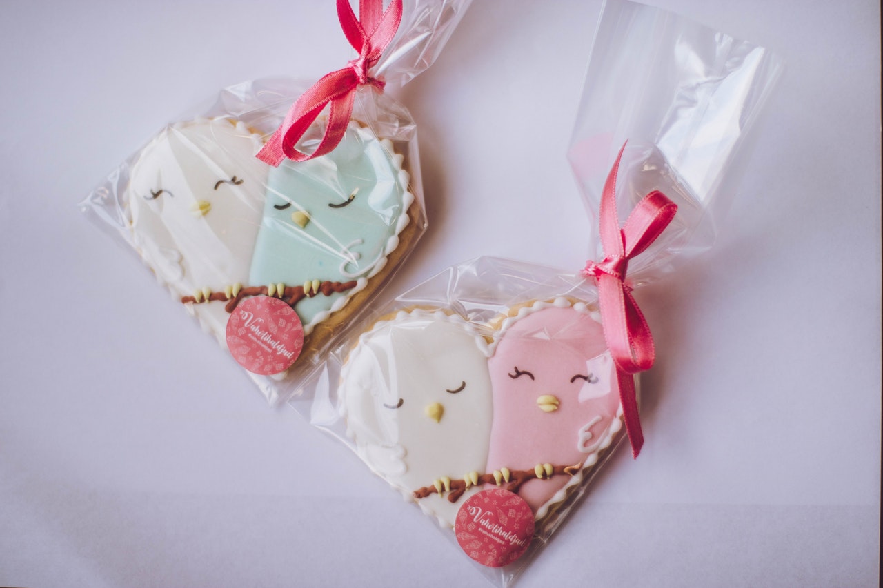 Two heart shaped cookies in separate bags