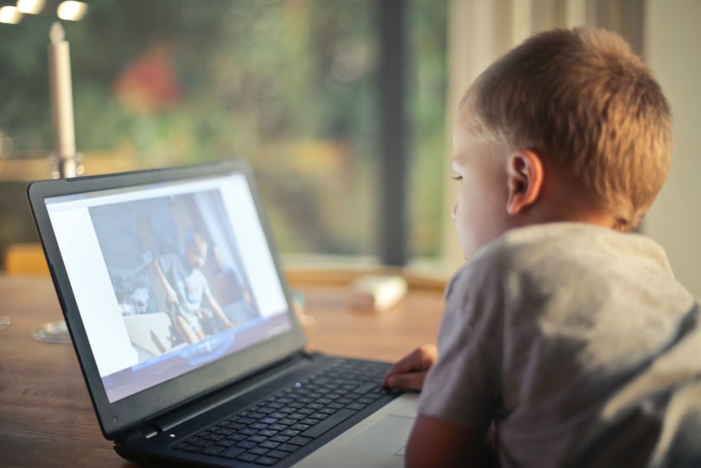 Child looking at a computer