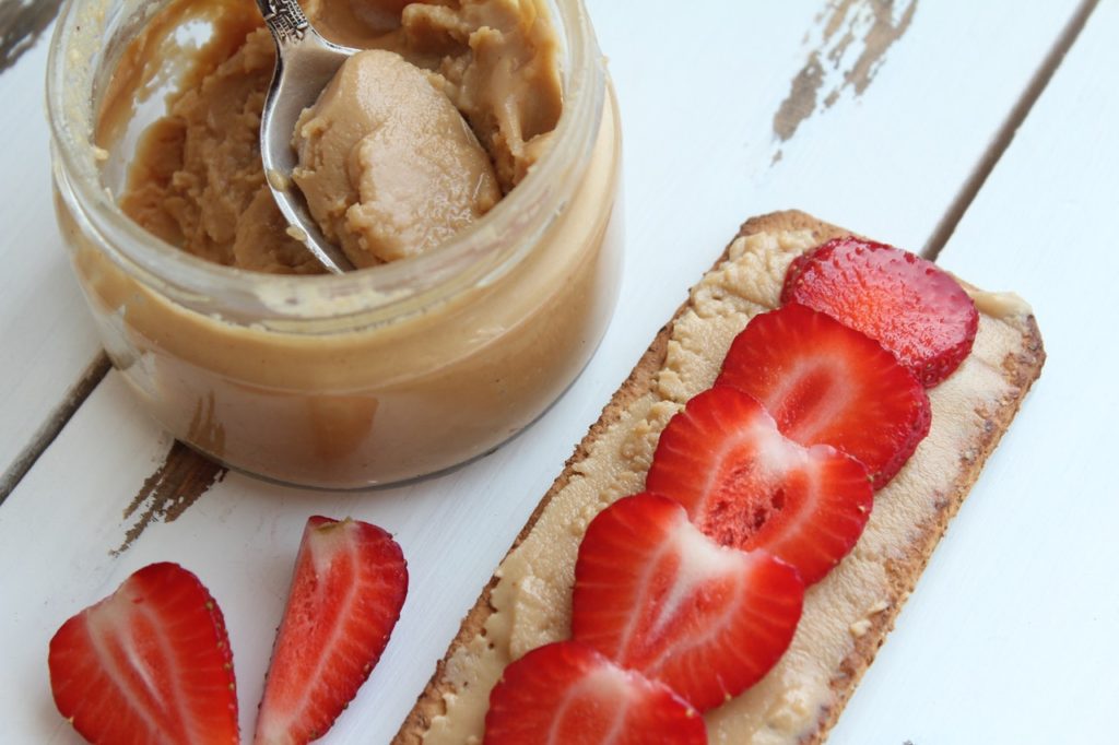 Strawberries and peanut butter on a cracker