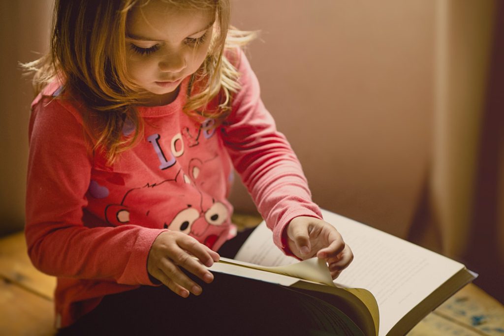 Girl flipping through a book