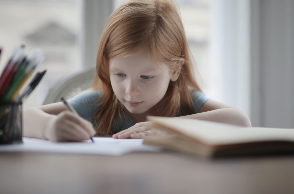 Girl writing at a desk