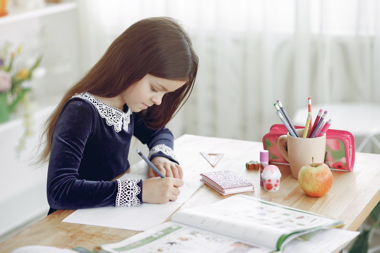 Girl writing at a desk