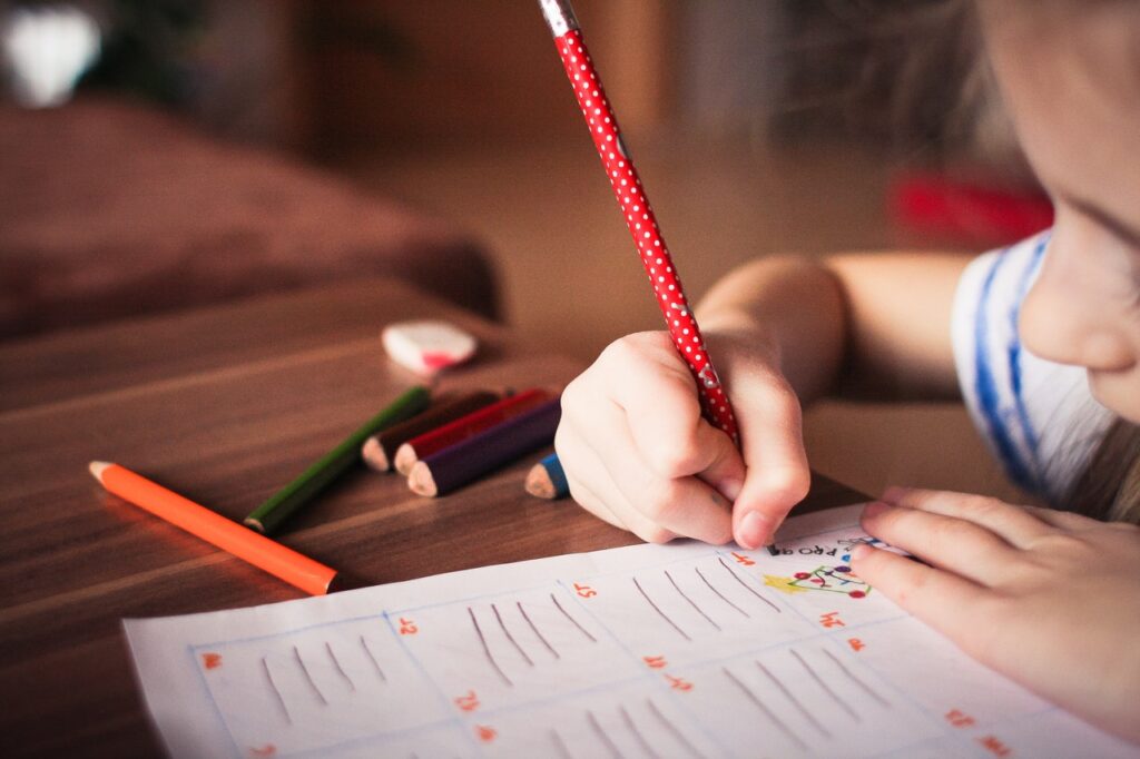 Little girl writing