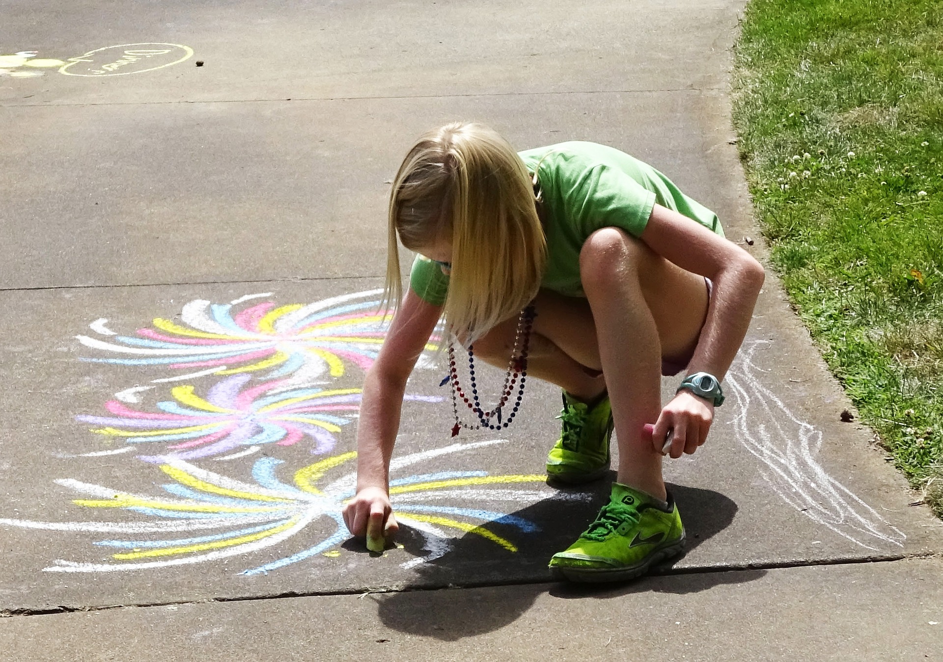 Drawing on sidewalk with chalk