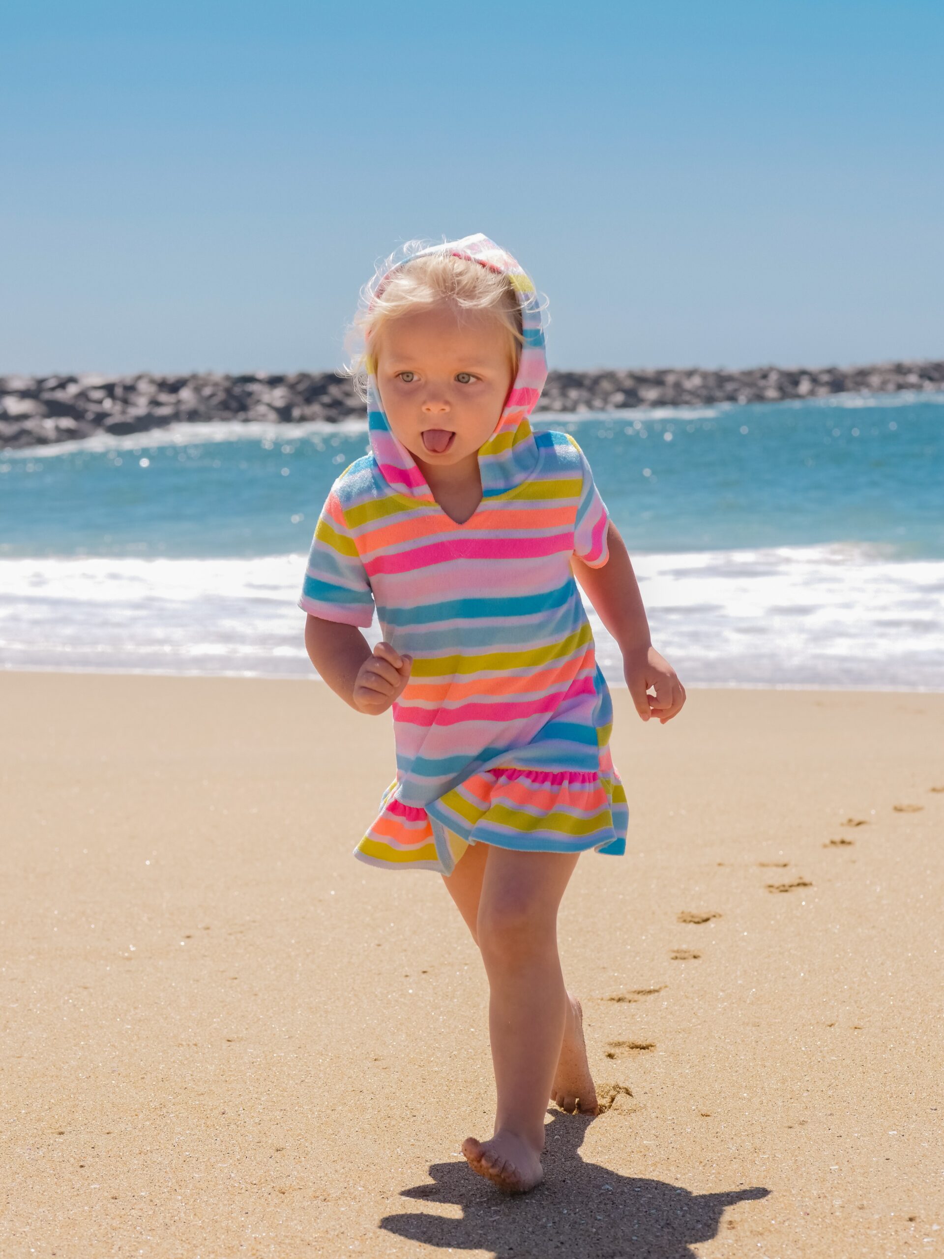 Child on beach on sunny day