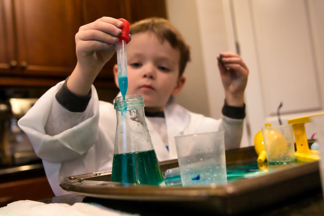Young child experimenting with science