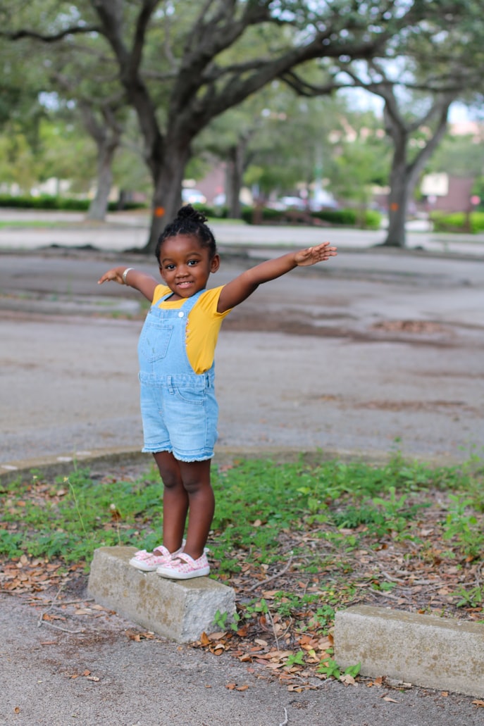 Young girl smiling in parking lot