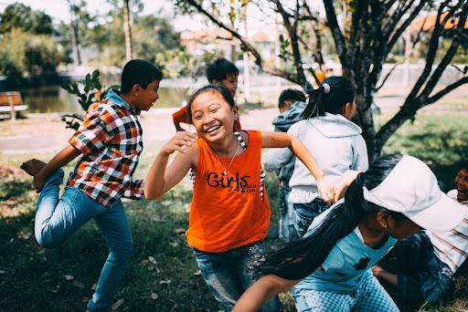 Kids Playing outside of Preparatory School